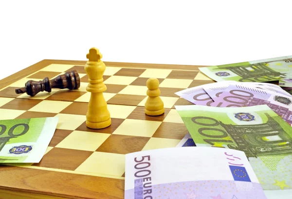 Geld und Schach — Stockfoto