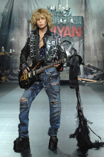 Moscow Fashion Week in Gostiny Dvor. Russian showman Sergey Zverev with a guitar on the show of fashion designer Ilya Shiyan, MOSCOW, RUSSIA