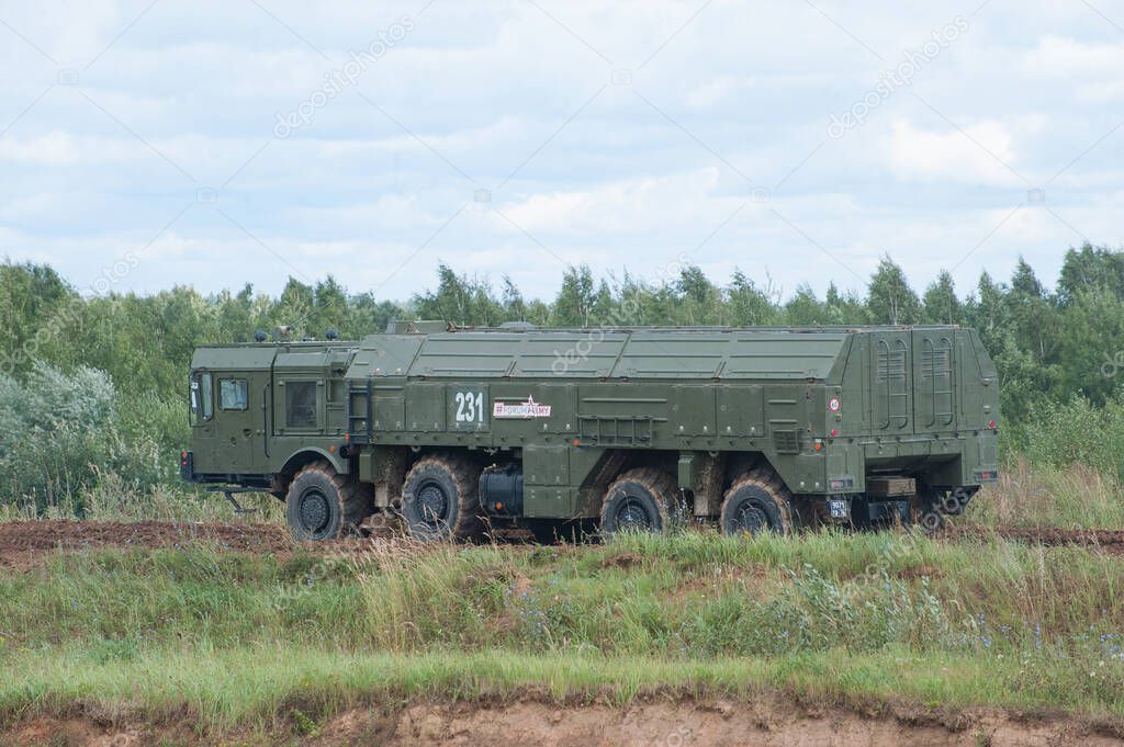 MILITARY GROUND ALABINO, MOSCOW OBLAST, RUSSIA - Aug 24, 2017: Russian operational-tactical missile complex Iskander (SS-26 Stone) motion on ground Alabino,military-technical forum Army-2017,left side