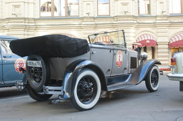 Soviet retro car GAZ-A (licensed copy Ford-A) for retro rally Gorkyclassic in the Parking lot near Gum Department store, Moscow, side view — Stock Photo, Image