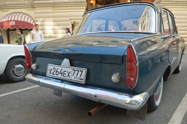 Soviet car Moskvich-408 on retro rally Gorkyclassic, GUM, Moscow, rear view clipart
