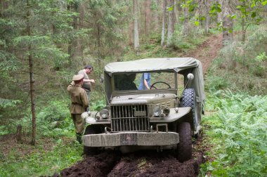 American military retro car Dodge WC-51 stuck in the woods, 3rd international meeting 