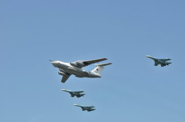 Modern Russian aircrafts A-50 and Sukhoi Su-27 developed in the Soviet Union in the sky over Moscow flies up to Red Square