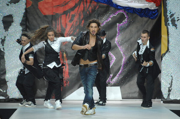 Moscow Fashion Week in Gostiny Dvor. Russian singer Dima Bilan with the dancers on the show designer Ilya Shiyan