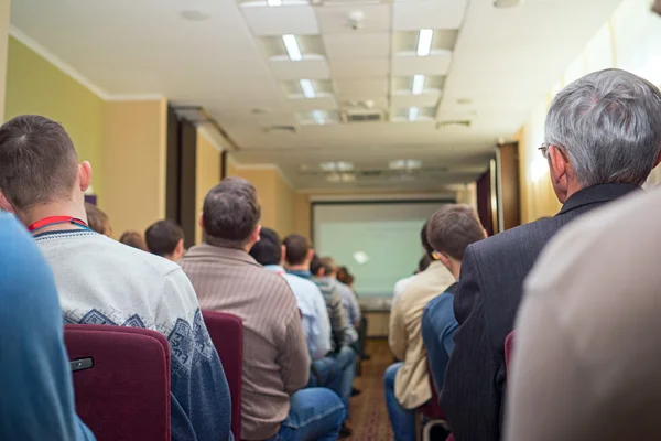 University students sitting in a lecture room view from back of the classroom — Stock Photo, Image