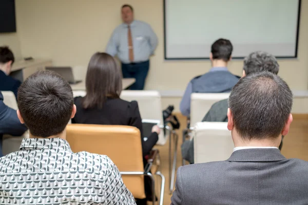 Rear view of people participating in the business training. — Stock Photo, Image