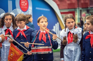 Russia, Moscow - September 11, 2016: Moscow City Day. Moscow residents and guests celebrate the 869 anniversary of the city. Performance on Tverskaya Street. Public-event. Pioneer drummer children. clipart