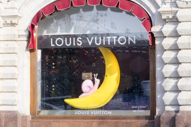 Moscow, Russia - February 20, 2022: Louis Vuitton store at Moscow. Design with bag on snail in banana or moon.