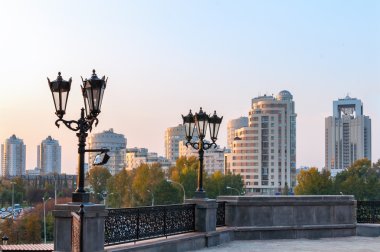Yekaterinburg town throw the street lights in the evening clipart