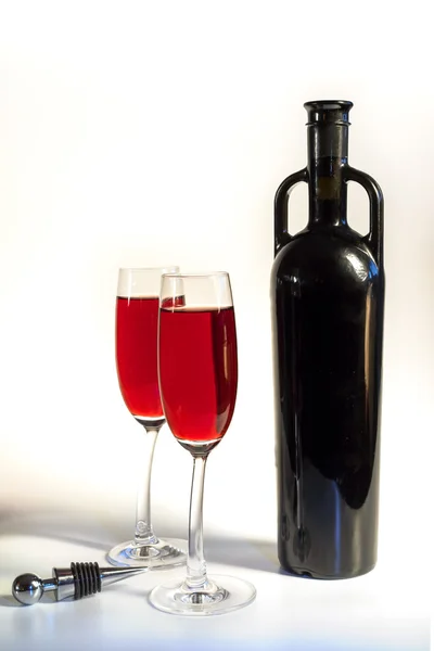 Original red vine bottle and two wine glasses on the white background — Stock Photo, Image