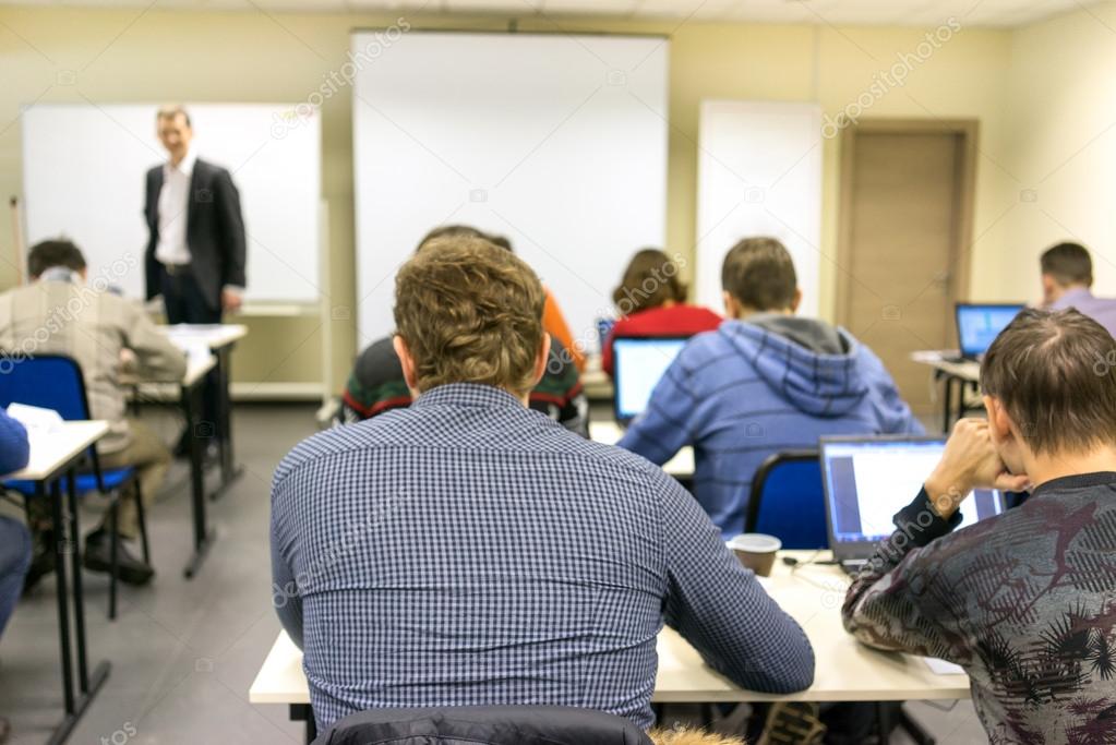 People sitting rear at the computer training class
