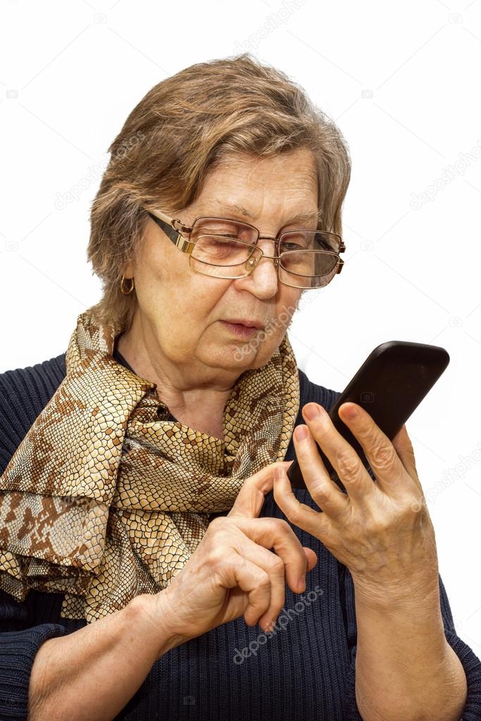 Pensioner woman with two pair of glasses dealing cell phone on