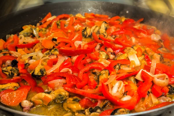 Seafood paella cooking in the fry pan — Stock Photo, Image