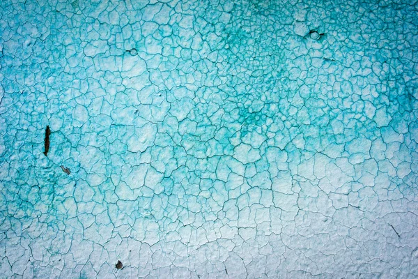 Grov texturerat blå vägg med fläckar — Stockfoto