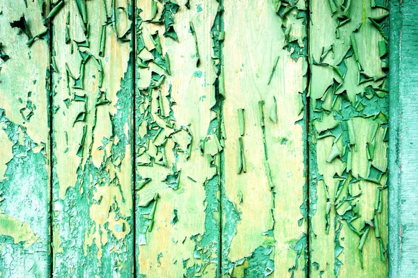 Peeling verf op een houten muur achtergrond — Stockfoto
