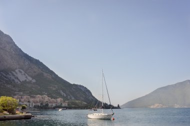 Small sport fishing boat with Montenegro Kator as a background