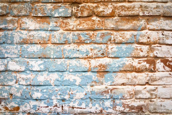 老式褪了色的砖砌墙的橙色和蓝色的颜色，时尚城市墙背景 — 图库照片