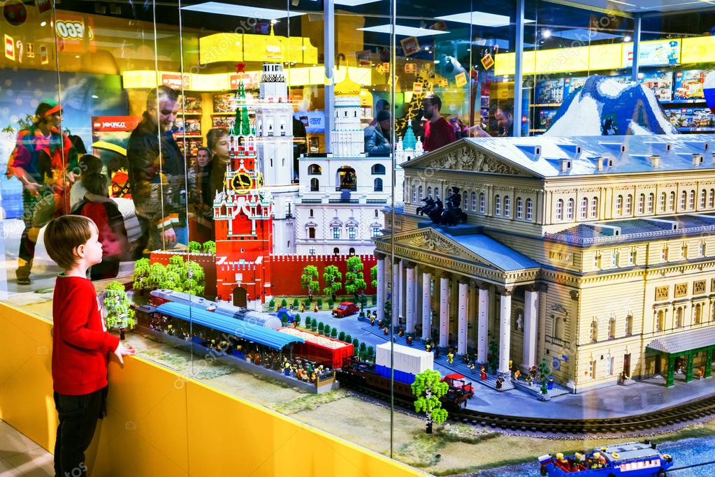 MOSCOW, RUSSIA - DECEMBER 11, little boy looking at the Moscow sights as Bolshoy theatre and Red Square made by Lego blocks Central Children's Store on Lubyanka. – Stock Editorial Photo © Elf+11 #93109270