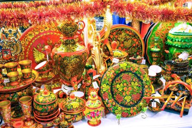 MOSCOW, RUSSIA - DECEMBER 11, 2015: Moscow souvenirs, traditional handmade hohloma dishes in Central Children's Store on Lubyanka