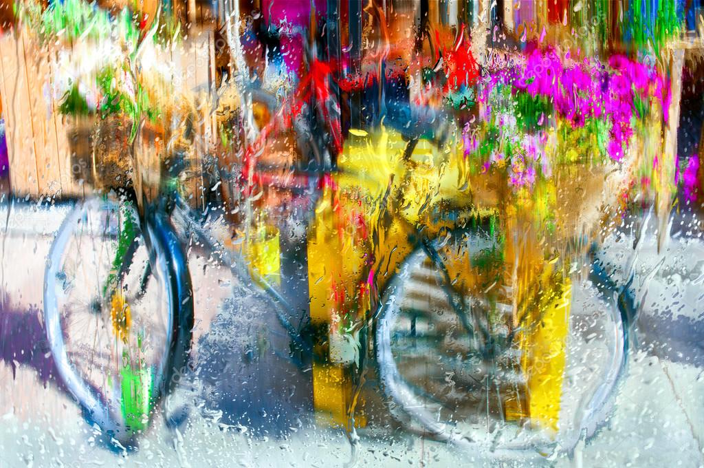 Vintage Bicycle Decorated With Red Flowers Stands On The Street