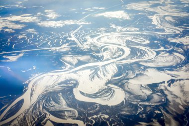 Aerial view of the river in time of sunny winter day.