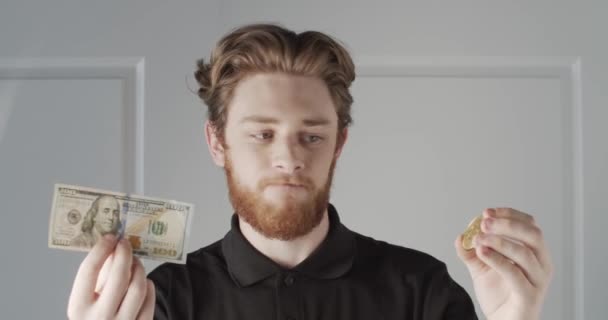 Man Holding Golden Bitcoin Logo — Stock Video
