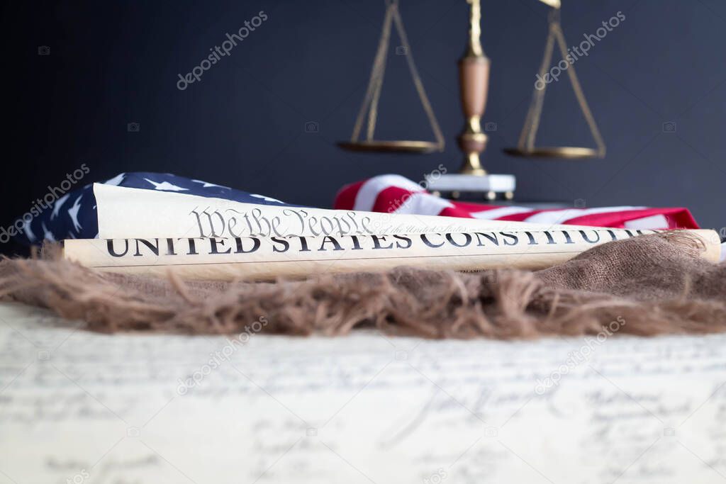 Constition of the USA with US flag