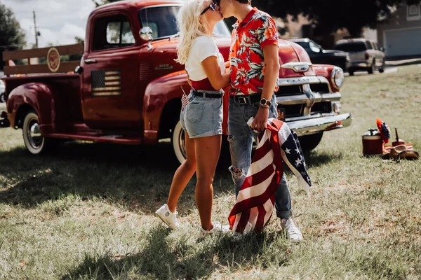 Couple in a vintage red truck