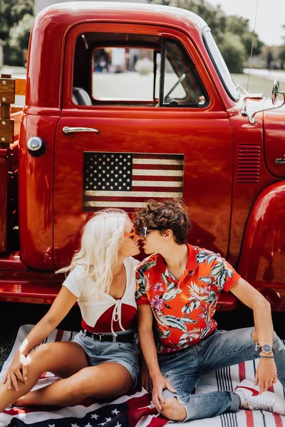 Couple in a vintage red truck