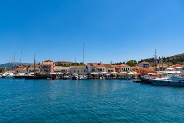 Fiskardo,Greece - August 11 2025: Fiskardo village, Kefalonia island, Greece. Boats and yachts along the quayside of Fiskardo on the Greek Ionian islands of Kefalonia.