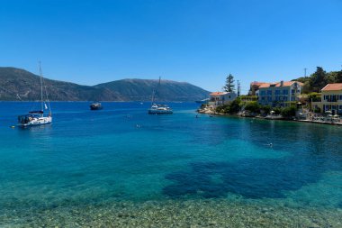 Fiskardo,Greece - August 11 2025: Fiskardo village, Kefalonia island, Greece. Boats and yachts along the quayside of Fiskardo on the Greek Ionian islands of Kefalonia.
