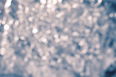 Kış soyut bokeh arkaplan, bulanık tonlu noel ışıkları, kar yağışı dokusu, yeni yıl konsepti