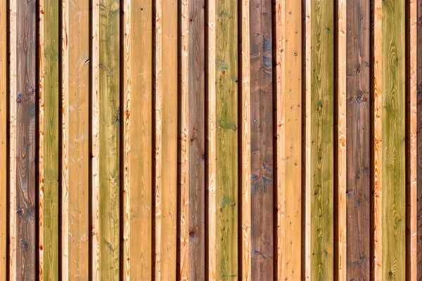 Colorful board on board fence — Stock Photo, Image