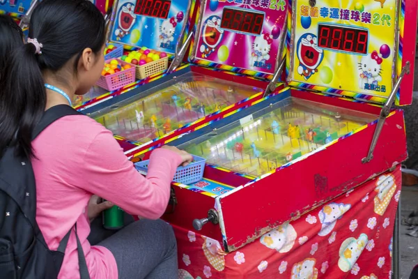 On the New Years Day Street in Taipei, vendors set up pinball game machines to do business