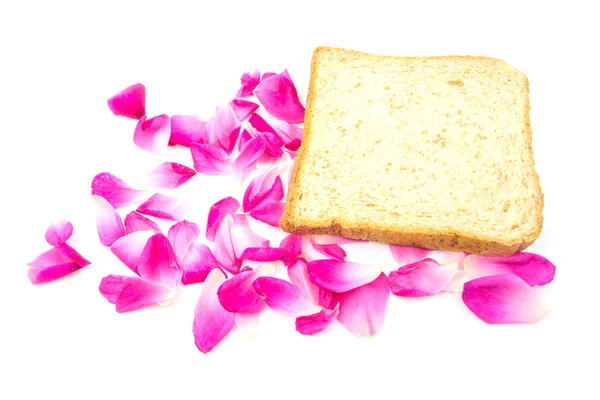 Rosa com pão de trigo integral isolado no fundo branco — Fotografia de Stock