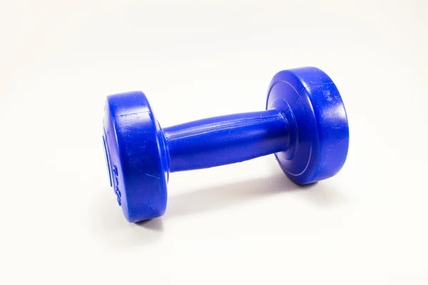 Blue color dumbbell of weight training in studio — Stock Photo, Image