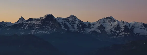 Famous mountains Eiger Monch and Jungfrau at sunrise — Stock Photo, Image