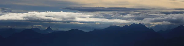 Moody sky over Mount Grosser Mythen and other mountains of the Swiss Alps.