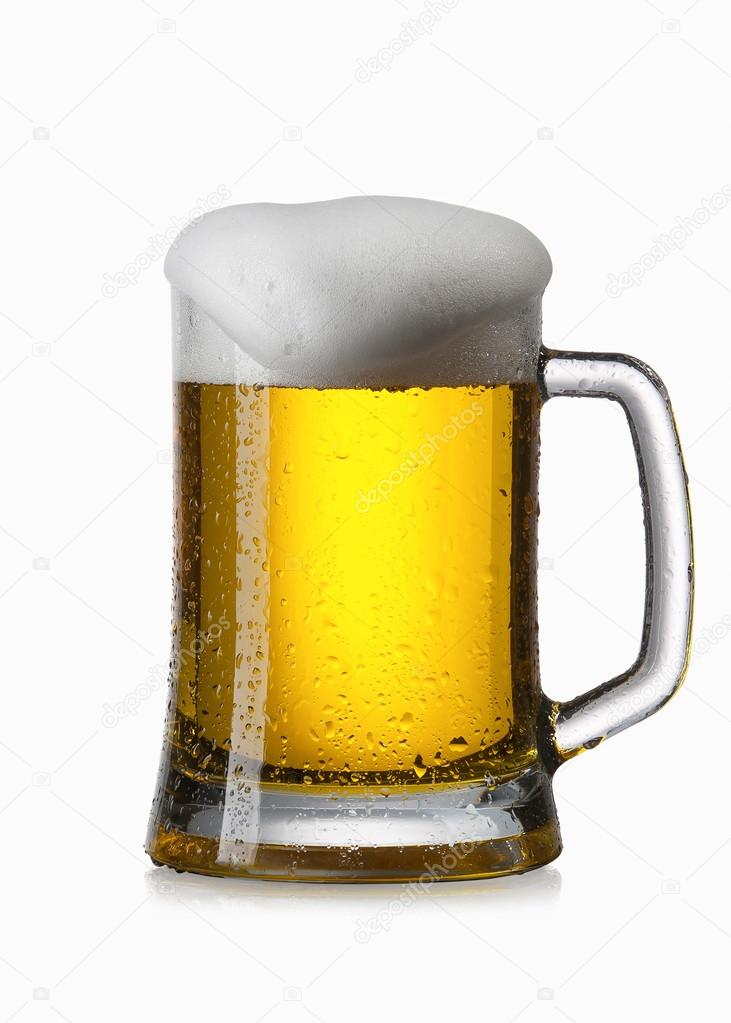 Light beer into glass isolated on white