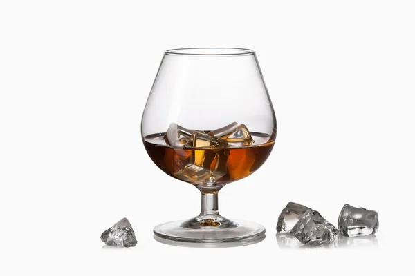 Whiskey with ice cubes in glass — Stock Photo, Image