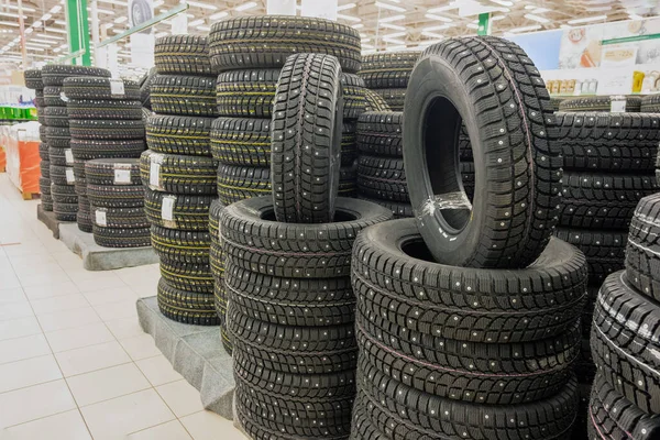 Winter studded tires in the supermarket of automobile tires. — Stock Image Winter Studded Tires Supermarket Automobile Tires Royalty Free Stock Photos