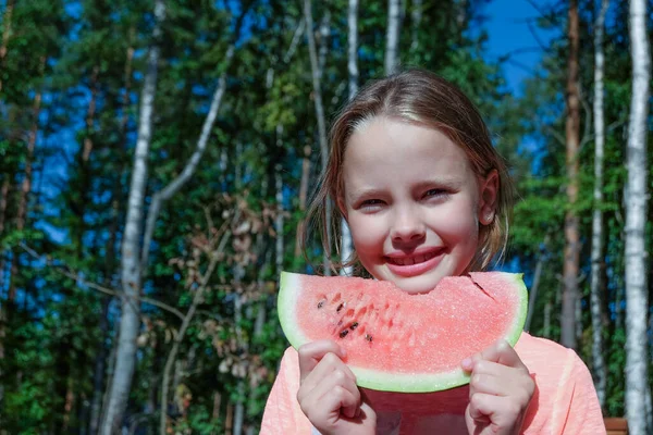 summer concept. Happy young girl eating watermelon on a sunny day. Youth lifestyle. food, relaxation, tasty, happiness, joy, beach.