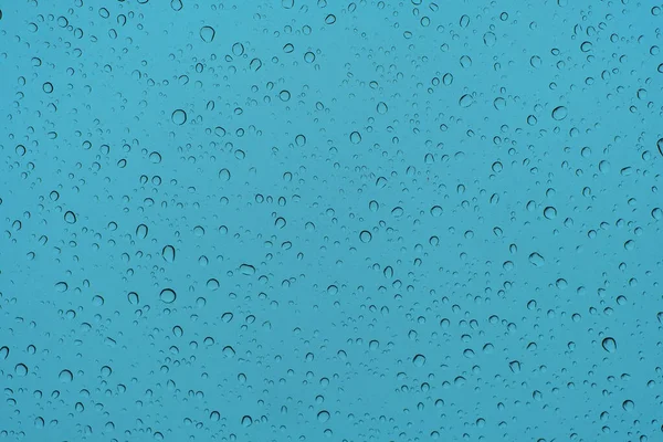 Konzeptioneller Hintergrund Wassertropfen Auf Blauem Glas — Stockfoto