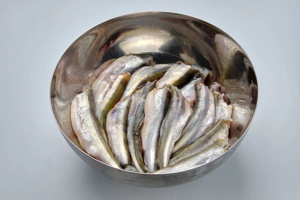 cut fresh fish in a bowl isolated on a white background