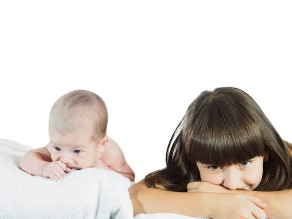 Caucasian child sister and baby brother lying together isolated on white — Stock Photo, Image