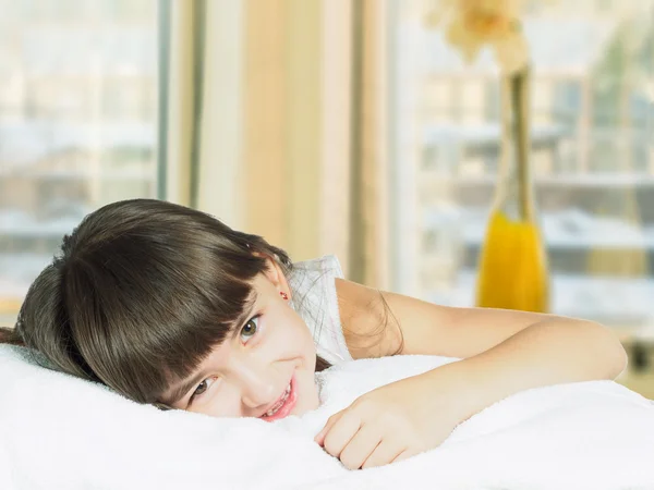 Portrait of caucasian funny girl child kid on the bed home — Stock Photo, Image