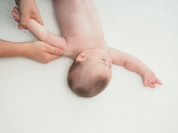 Doctor massage small caucasian baby hand — Stock Photo, Image