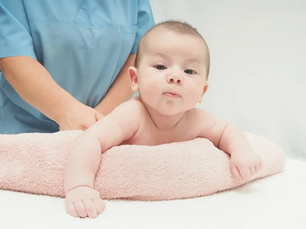 Doctor massage small caucasian baby — Stock Photo, Image