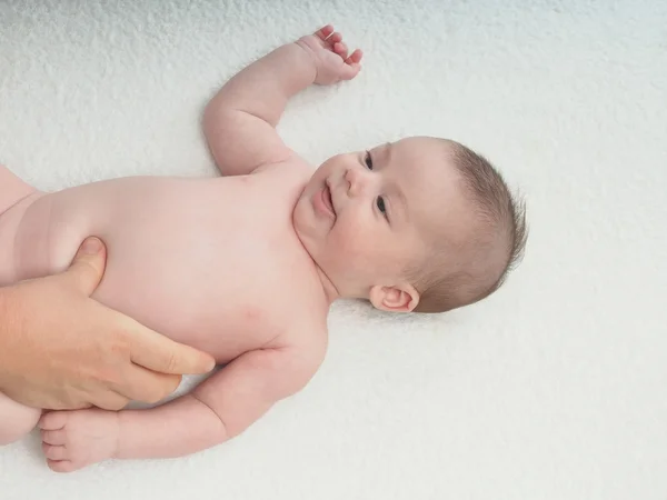 Läkare massage liten kaukasiska baby Stockbild