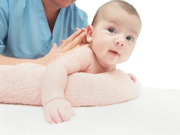 Läkare massage liten kaukasiska baby isolerade Royaltyfria Stockbilder